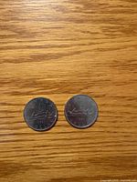 Both 1981 Canadian dollar coins reverse side showing voyageur design