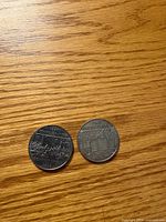 Both 1982 Constitution dollar coins reverse side showing Confederation design