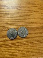 Obverse sides of two 1984 Canada $1 Jacques Cartier coins