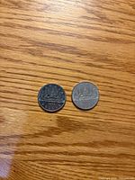 Obverse view of both 1986 Canada $1 coins