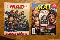 Front covers of both MAD magazines
