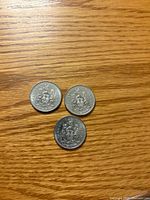 Three 1982 Canada 50-cent coins reverse side with Coat of Arms