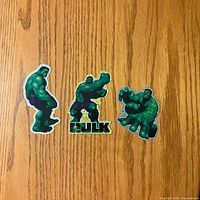 Front view of the three Hulk stickers showing artwork