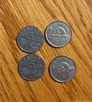 Obverse side of four Canada 5 cent nickel coins dated 1936, 1936, 1937, 1939