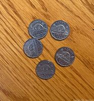 Five 1953 Canadian nickels reverse side with beaver design visible