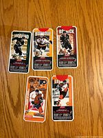 Fronts of five 1999-00 Jell-O NHL hockey cards: Modano, Bourque, Roenick, Boucher, LeClair