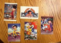 Front view of five illustrated Betty Boop postcards