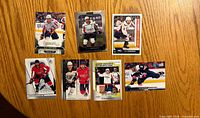Front view of seven Alexander Ovechkin hockey cards arranged on tabletop