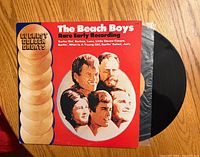 Front view of The Beach Boys Rare Early Recording LP showing sleeve artwork and vinyl partially exposed