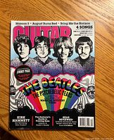 Front cover of Guitar World magazine featuring The Beatles psychedelic years headline and portraits