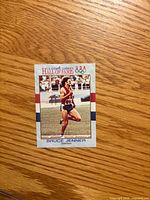 Front of Bruce Jenner U.S. Olympic Hall of Fame card showing action photo and border