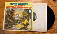 Front cover of Buffalo Springfield Retrospective LP with record partly removed