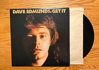 Front jacket showing album artwork and partial vinyl with inner sleeve