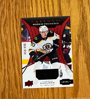 Front of Karson Kuhlman Trilogy Rookie Premiers Level 1 jersey card showing photo, jersey swatch and serial number