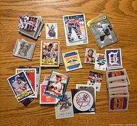 Overview of all mini sports and wrestling trading cards laid out on surface