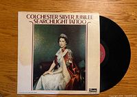 Front sleeve showing title, artwork, and vinyl record partially visible