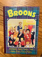 Front cover of The Broons hardcover comic showing tartan design and character artwork