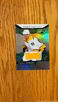 Front of Upper Deck Trilogy Rookie Premieres Level 1 Vladislav Kamenev jersey card showing player image, yellow jersey swatch and serial numbering
