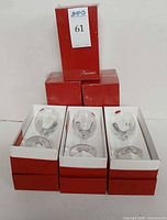 Six red Baccarat boxes with glasses, lot overview