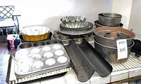 Group shot of assorted bakeware stacked on counter
