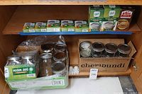 Overall view of jars and lid boxes on shelf