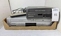 Front view showing Panasonic DVD/VCR, Orion VCR and remote