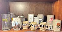 Full shelf showing all steins and mugs