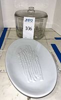 Glass cheese preserver and porcelain asparagus platter, overall lot view