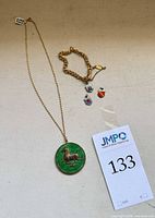 Necklace, bracelet and three charms overview