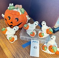 pumpkin cookie jar with four ghost candleholders
