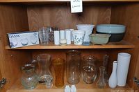 Full view of all vases, bowls and planters on shelves