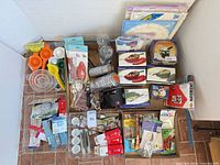 Overview of packed box full of new kitchen gadgets and utensil sets