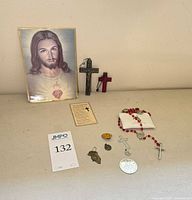 Group shot shows all items: holy cards, rosary, crucifixes, medals and pouch