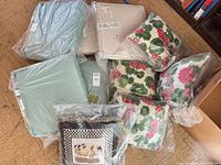 Group of all cushions in plastic wrap on floor