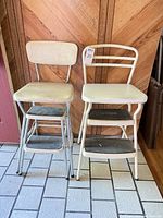 Front view both Cosco step stools side by side