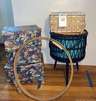 Overall lot view showing wicker basket, three floral boxes, embroidery hoops