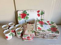 Full lot showing plates, mugs, tray, napkins