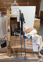 Overall lot with skis, poles, washboard, birdcage, textiles and boxes