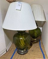 Pair of green glass lamps with white shades