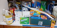 Countertop view showing full assortment of cleaners, cloths, refills and tools