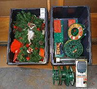Two totes opened showing garland, angel, reels, light boxes