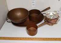 Overall lot showing bowl, tray, two saucepans, stack of poacher pans