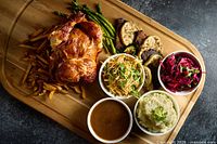 Plated chicken meal with sides representing restaurant cuisine