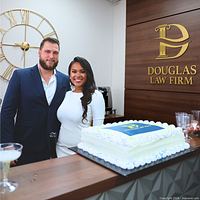 Promotional image showing a couple at Douglas Law Firm office