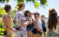 Group of adults outdoors during wine tour