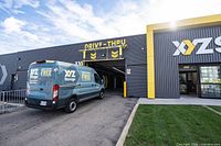 Exterior view of XYZ Storage facility with branded van