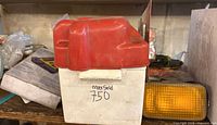 Red/white plastic case believed to hold 12 V air compressor
