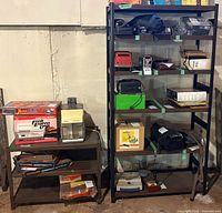 Tall five-tier shelving unit and smaller shelving unit side by side