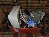 Box containing router carton, coax cables, connectors and accessories