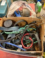 Box containing mixed bungee cords, straps and accessories